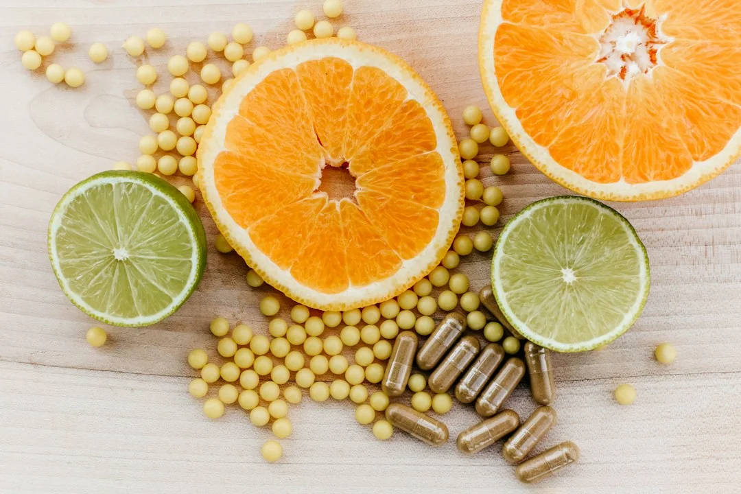oranges, peas, and limes on a wooden table oranges, peas, and limes on a wooden table