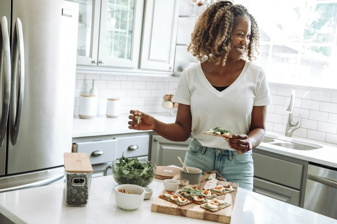 a woman in a kitchen a woman in a kitchen